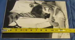 1977 Sandy Underwood photograph; Doctor examining child #3, 9 1/2″ x 14″