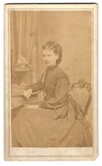 Photograph Lady in Elegant Dress Sitting on Chair