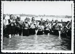 funny men playing music in the river, trumpet, boyfriends, gay int., unusual, Vi