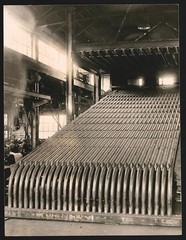 Photograph of steel pipes used as cooling fins in a factory