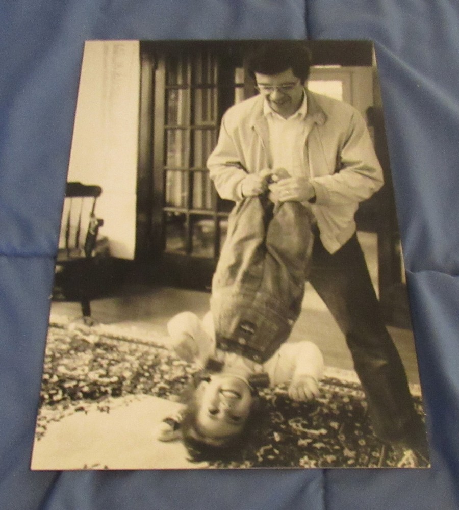 1977 Sandy Underwood photograph; man playing with child, 9 1/2″ x 14″