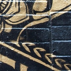 Street Art Gold on Black Brick NYC, Litho Print on Board, Photograph 18″ x 24″